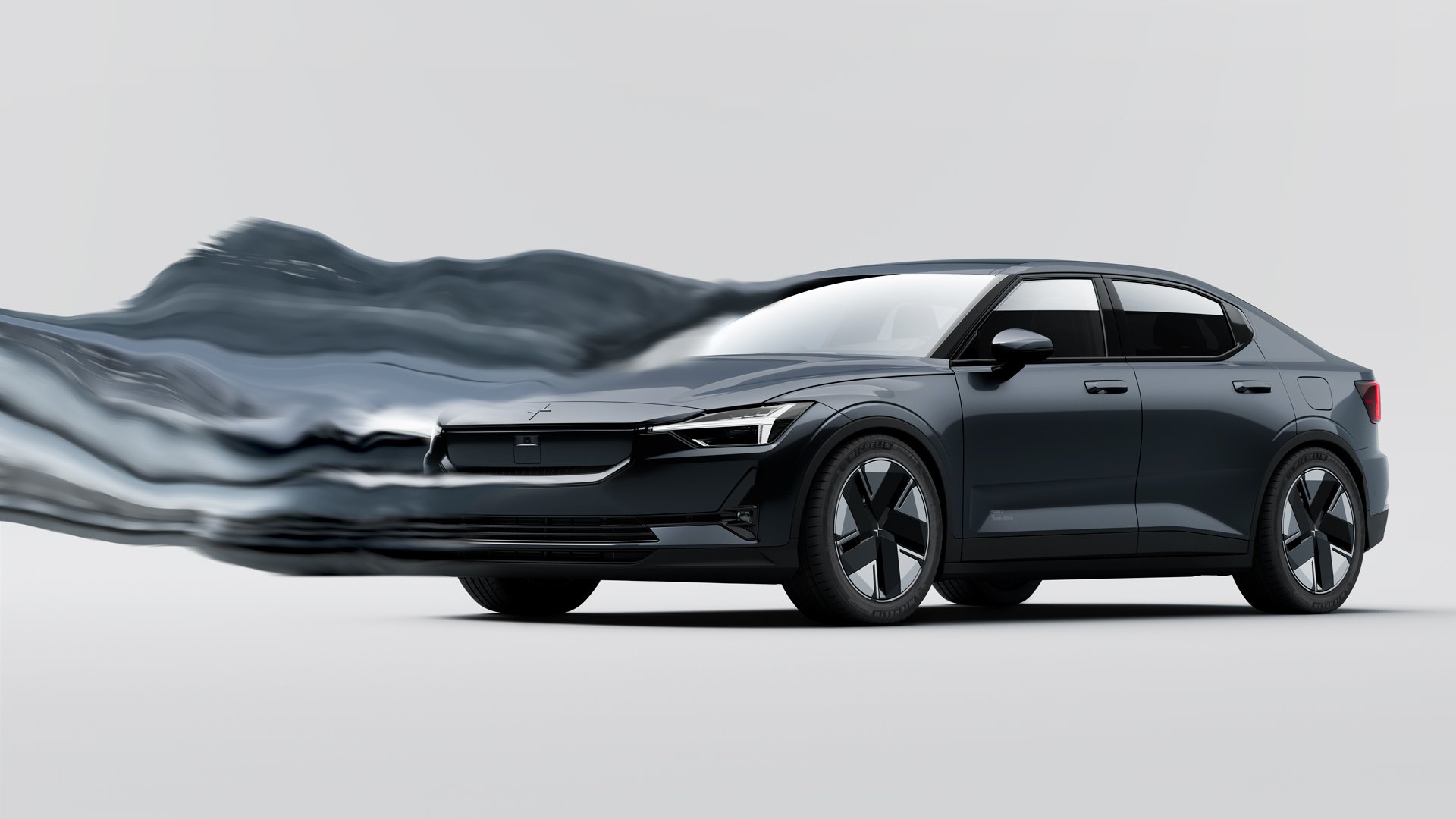 En mørk blå Polestar 2 i studio med en morph effekt hvor bilen dras ut